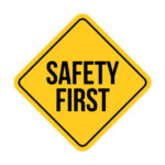 Safety first sign caution vector concept. Safety first icon road sign background security.